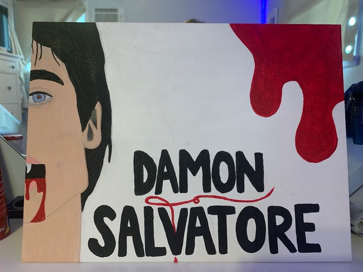 there is a sign that says demon salvatore on the side of a table