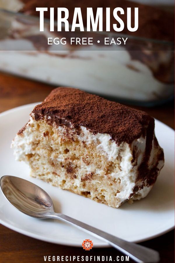 a piece of tiramu cake on a plate with a fork and spoon next to it