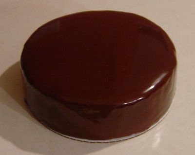 a chocolate cake sitting on top of a white counter