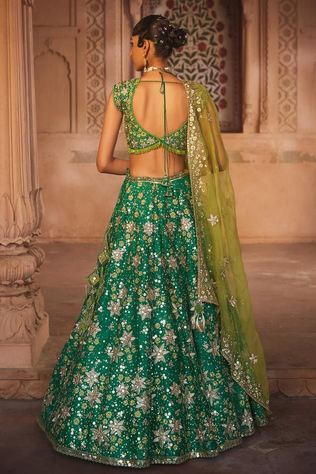 Green lehenga in floral pattern with zari embroidery and, splatter highlighting on the border and attached cancan. Paired with an embellished blouse with bead detailing and organza dupatta. Components: 3 Pattern: Embroidered Type Of Work: Bead, Zari Neckline: Leaf Sleeve Type: Cap Fabric: Lehenga and Blouse: Pure Silk, Dupatta: Net Color: Green Other Details:  Length: Lehenga: 44 inches Occasion: Mehendi and Haldi, Wedding - Aza Fashions Lehenga And Blouse, Colour Composition, Raw Silk Lehenga, Green Lehenga, Indian Wedding Wear, Lehenga Blouse, Embellished Blouse, Fern Green, Special Occasion Outfits