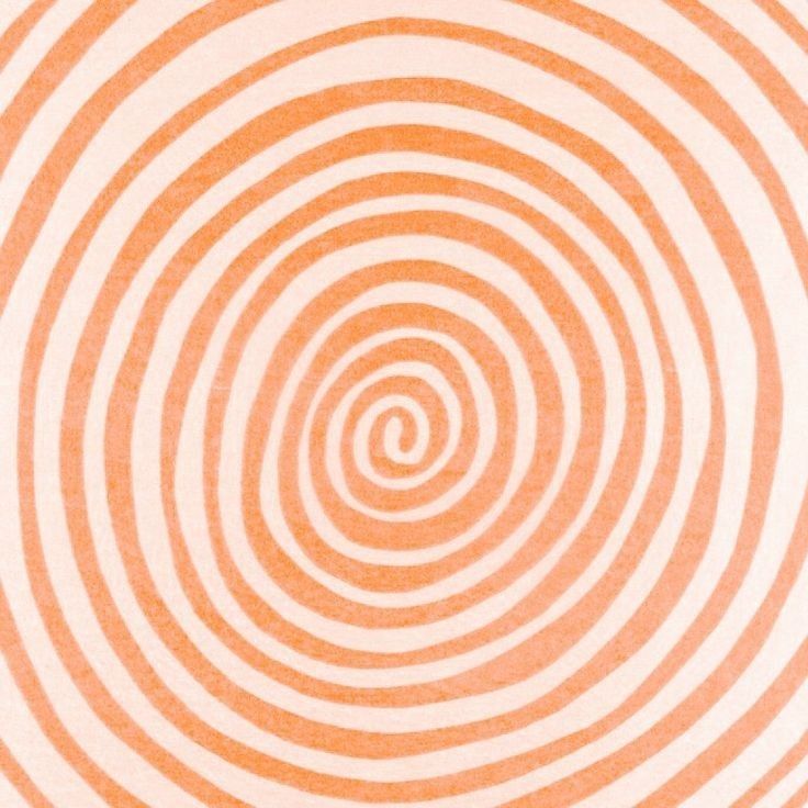 an orange and white striped background with spirals in the center, as if it were made out of paper