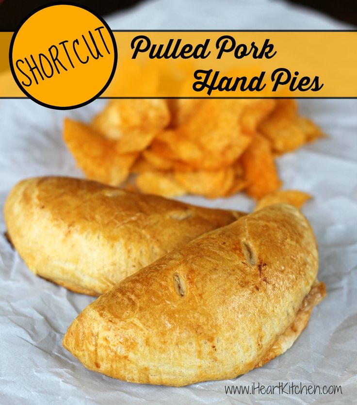 two puffed pork hand pies next to some potato chips