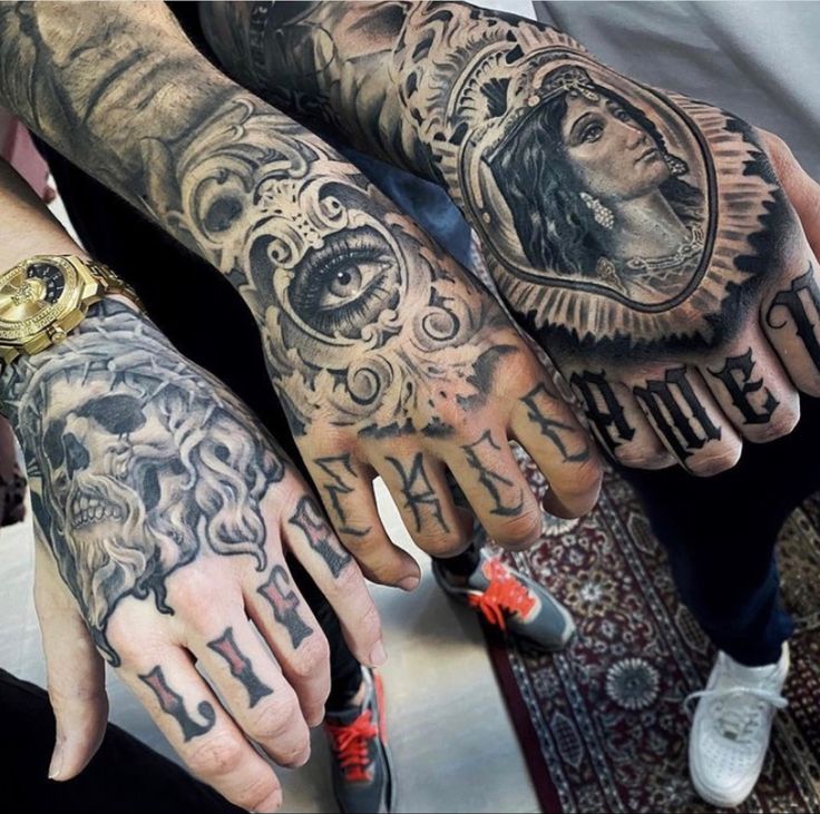 several people with tattoos on their hands and arms