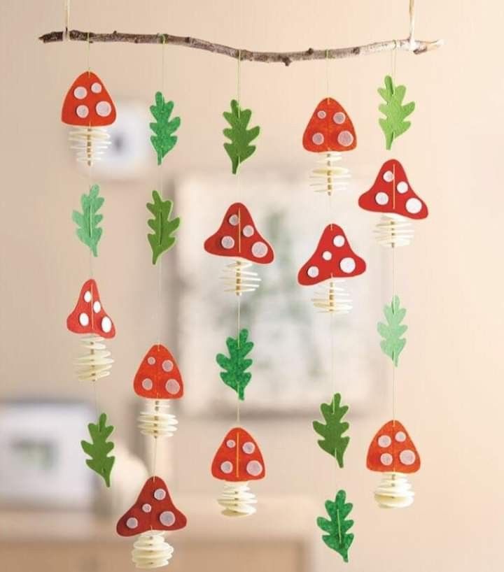 a group of mushrooms hanging from a tree branch