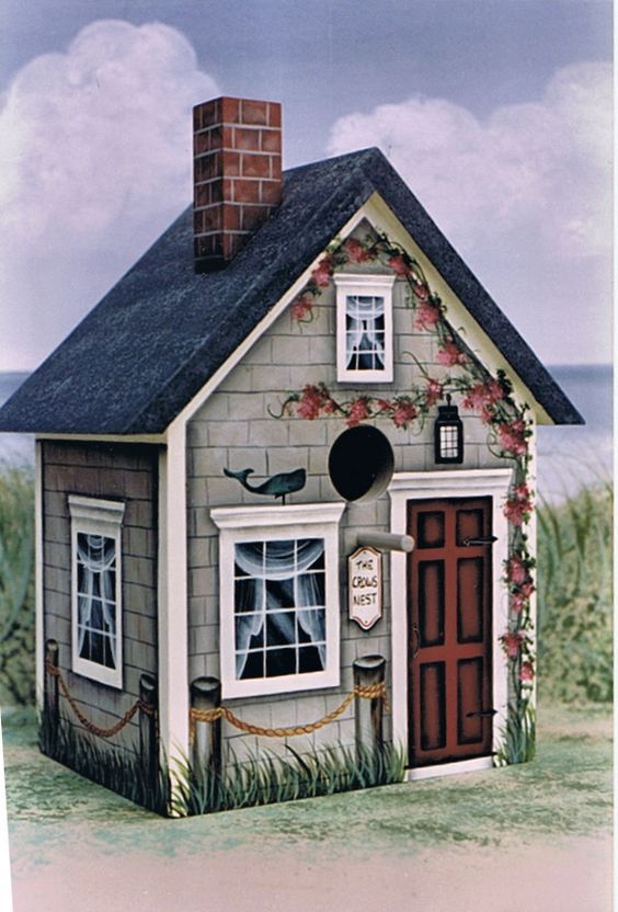 a drawing of a small house with flowers on the roof and windows, along with a chimney