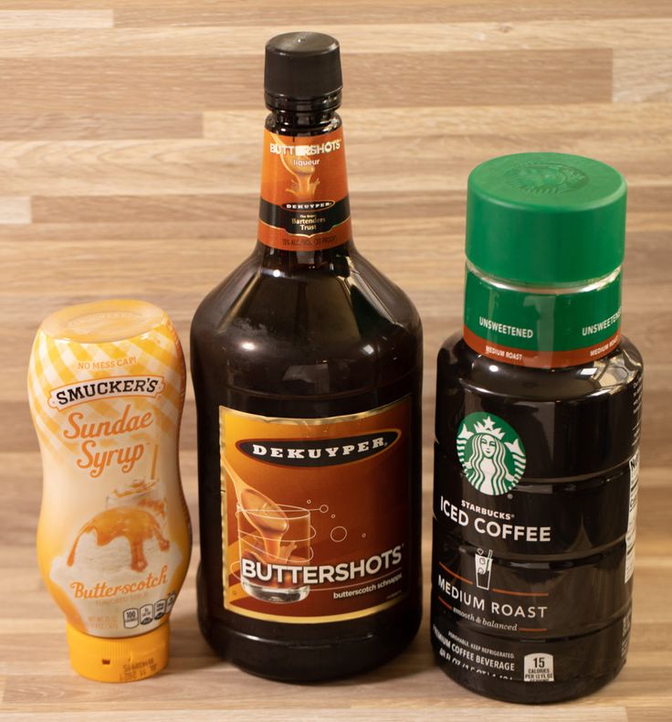 three different types of condiments sitting on a table