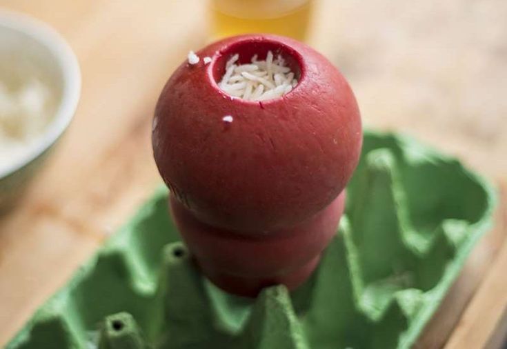 a red object sitting on top of a green tray