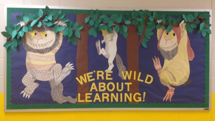 a bulletin board with an image of animals and trees on it that says, we're wild about learning