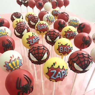 spiderman cake pops on a pink plate