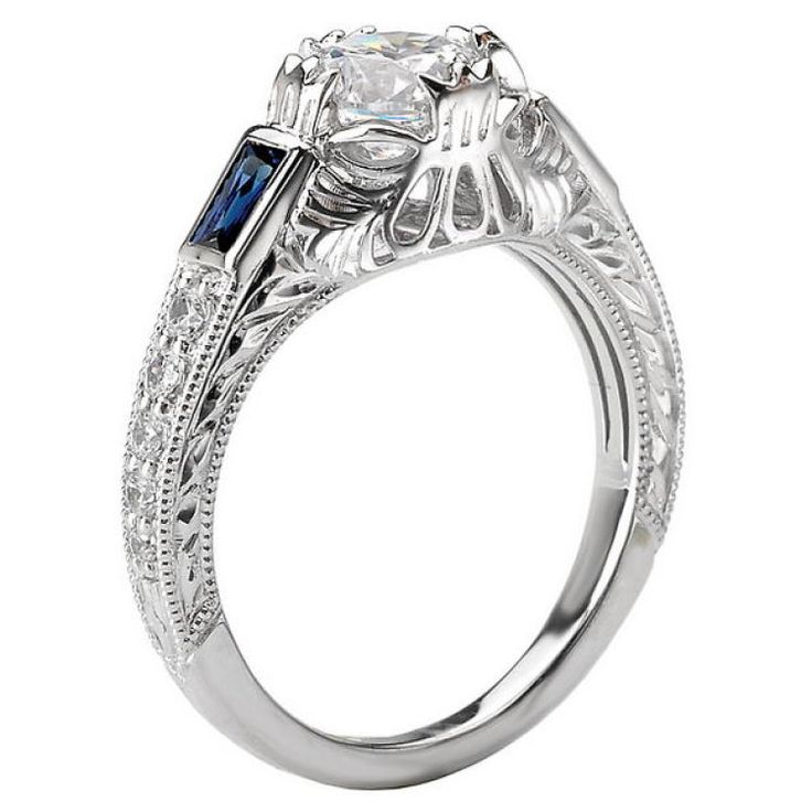 Blue Sapphire and Diamond Ring in 18kt White Gold with Milgrain and Engraved Detail. (D1/6 carat weight and Sapp. 5/8 carat weight) This item is a SEMI-MOUNT and it comes with NO CENTER STONE as shown but it will accommodate a 6.5mm round center stone. Semi Mount Ring, Sapphire And Diamond Ring, Blue Sapphire, Diamond Ring, Sapphire, White Gold, Things To Come, Ring, Stone