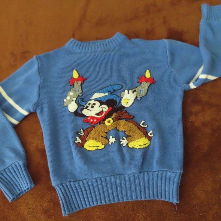 Great Shape For Age And Wear Vintage 70s 80s Mickey Two Gun Gunslinger Sweater Kids Toddler Made In Usa Rare Pit To Pit 14.5 Shoulder To Cuff 15.5 Shoulder To Shoulder 12.5 Top To Bottom 14.5 Retro Blue Tops For Fall, Blue Retro Tops For Fall, Blue Retro Fall Tops, Retro Blue Long Sleeve Sweater, Blue Long Sleeve Retro Sweater, Retro Blue Winter Top, Kid Clothes, Kids Sweater, Inner Child