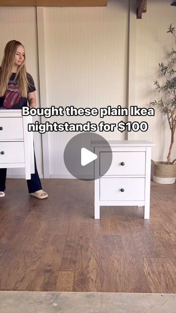 a woman standing next to two white nightstands on top of a hard wood floor