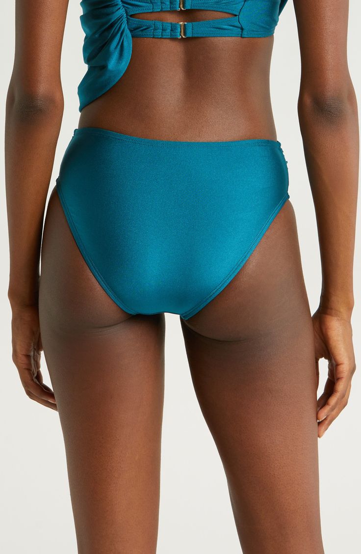 A draped, high waist sweetly shapes these bikini bottoms styled with a classic fit, versatile solid hue and moderate back coverage. Moderate back coverage Lined 82% nylon, 18% spandex Hand wash, dry flat Imported Solid Swim Skirt For Pool, Tie-side Bottoms For Poolside, Elastane Tie-side Bottoms For Poolside, Elastane Brief Tankini For Pool, Solid Color High Waist Swimwear With Wide Waistband, High Waist Solid Swim Skirt, Solid High Waist Stretch Swimwear, Solid High Waist Smoothing Tankini, Elastane Tie-side Bottoms For Beach Season