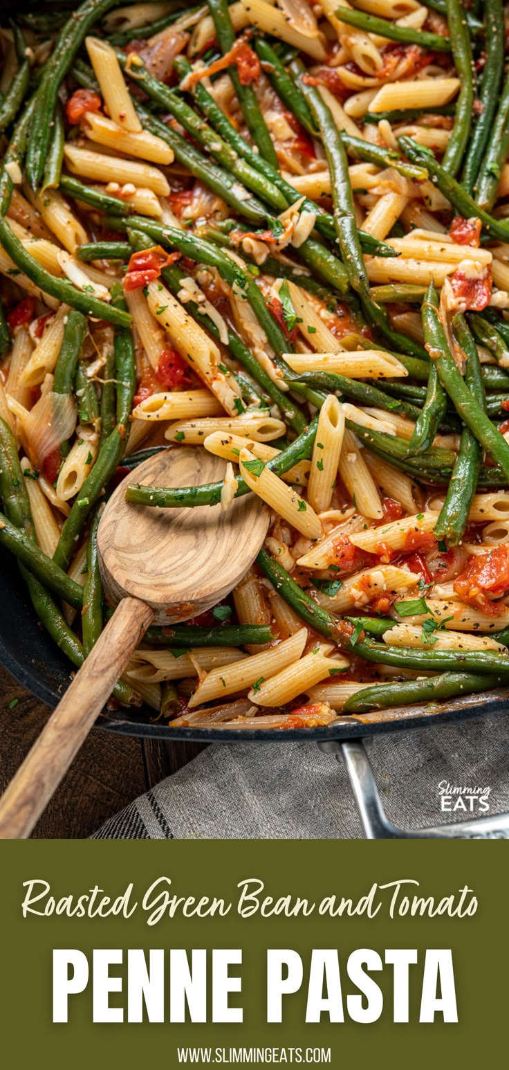 roasted green bean and tomato penne pasta in a skillet with a wooden spoon