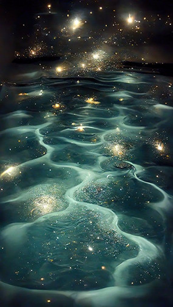 an image of some water with stars in the sky and on top of it, as if they were floating