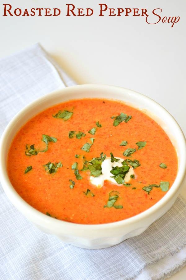 a white bowl filled with red pepper soup