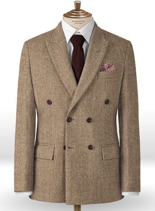 The Irish Brown Herringbone Tweed jacket will become the standard of business dressing and by far the most ubiquitous option. Crafted from wool, the Irish Brown color of the jacket will surely influence a veteran dresser to buy the jacket for building a sharp wardrobe. Team it up with matching trousers, white shirt and dark brown derby shoes. 
 
 Look Includes  Irish Brown Herringbone Tweed Fabric  Double Breasted Jacket Style  Peak Lapel  Real Horn Brown Buttons  Single Vent  Three Cuff Buttons Double-breasted Tweed Wool Coat For Formal, Double-breasted Tweed Wool Coat For Formal Occasions, Formal Double-breasted Tweed Wool Coat, Formal Tweed Outerwear With Double Button Closure, Business Casual Tweed Blazer With Suit Collar, Classic Tweed Jacket With Herringbone Pattern, Classic Tailored Tweed Jacket With Herringbone Pattern, Tailored Tweed Outerwear With Herringbone Pattern, Herringbone Tweed Jacket For Business