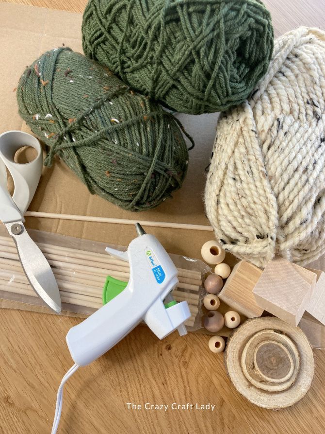 yarn, scissors and other craft supplies on a table