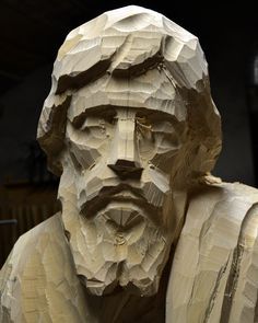 a sculpture of a man made out of paper