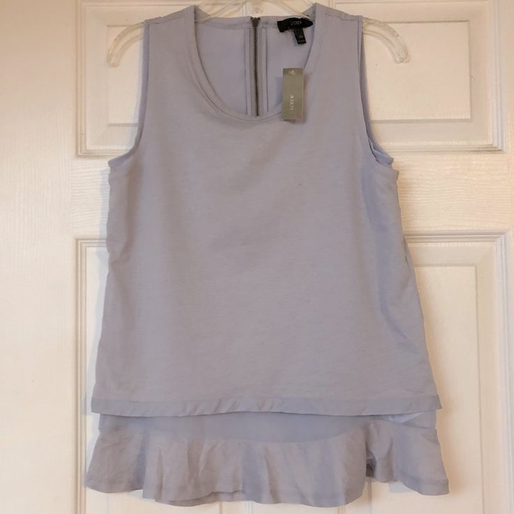 Nwt J Crew Ruffle Tank Top Shirt Size: Xxs Color: Lavender Bust 16” Length 23” Sleeveless Lavender Ruffled Top, Chic Lavender Tops With Ruffles, Chic Lavender Top With Ruffles, Chic Lavender Ruffled Top, Lavender Ruffled Tops For Spring, Lavender Ruffled Top For Summer, Spring Lavender Ruffled Tops, Lavender Tops For Spring Layering, Purple Top For Spring Layering