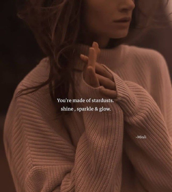 a woman wearing a sweater with the words you're made of standards, shine, sparkle & glow