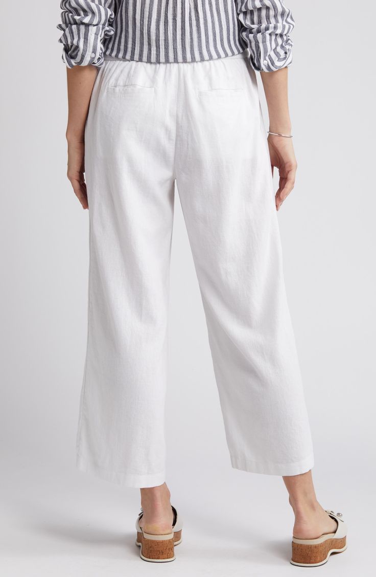 These lightweight linen pants are cut with cropped wide legs and topped with a comfortable elastic-drawstring waist. 25" inseam; 25" leg opening; 11" front rise; 15 1/2" back rise (size Medium) Elastic/drawstring waist Front slant pockets; back patch pockets 100% linen Machine wash, tumble dry Imported Relaxed Cropped Leg Bottoms For Spring, Relaxed White Ankle-length Bottoms, Relaxed White Ankle-length Pants, White Relaxed Ankle-length Pants, Relaxed Ankle-length White Bottoms, Spring Cropped Wide Leg Loungewear Pants, Relaxed Fit Capris For Vacation, Spring Cropped Wide Leg Lounge Pants, Relaxed Fit Ankle-length Capris For Vacation