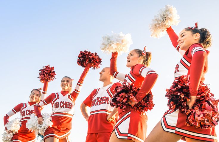 a group of cheerleaders are posing for the camera