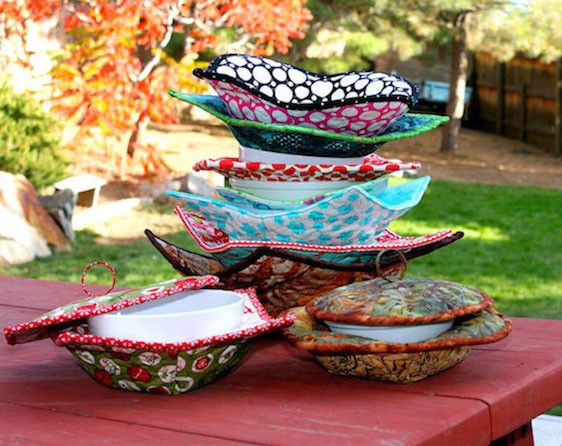 a stack of bowls sitting on top of a wooden table