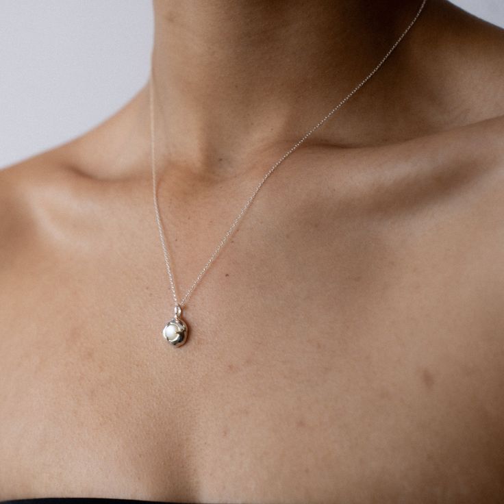 Embrace the gentle healing power of the sea with the soothing energy of Mother of Pearl. Our Keeper Necklace is crafted to hold its essence close to your heart, offering a constant source of comfort and serenity. Nestled delicately within the organically shaped three-pronged Keeper pendant, the Mother of Pearl radiates its tranquil aura. Technically known as "nacre," this crystallized mineral compound forms on the inner shell layer of select mollusks. Saltwater oysters, abalone, and freshwater m Healing Power, Healing Powers, Emotional Healing, Love Symbols, Silver Roses, Necklace Silver, Earring Necklace, Jewelry Care, Personal Growth