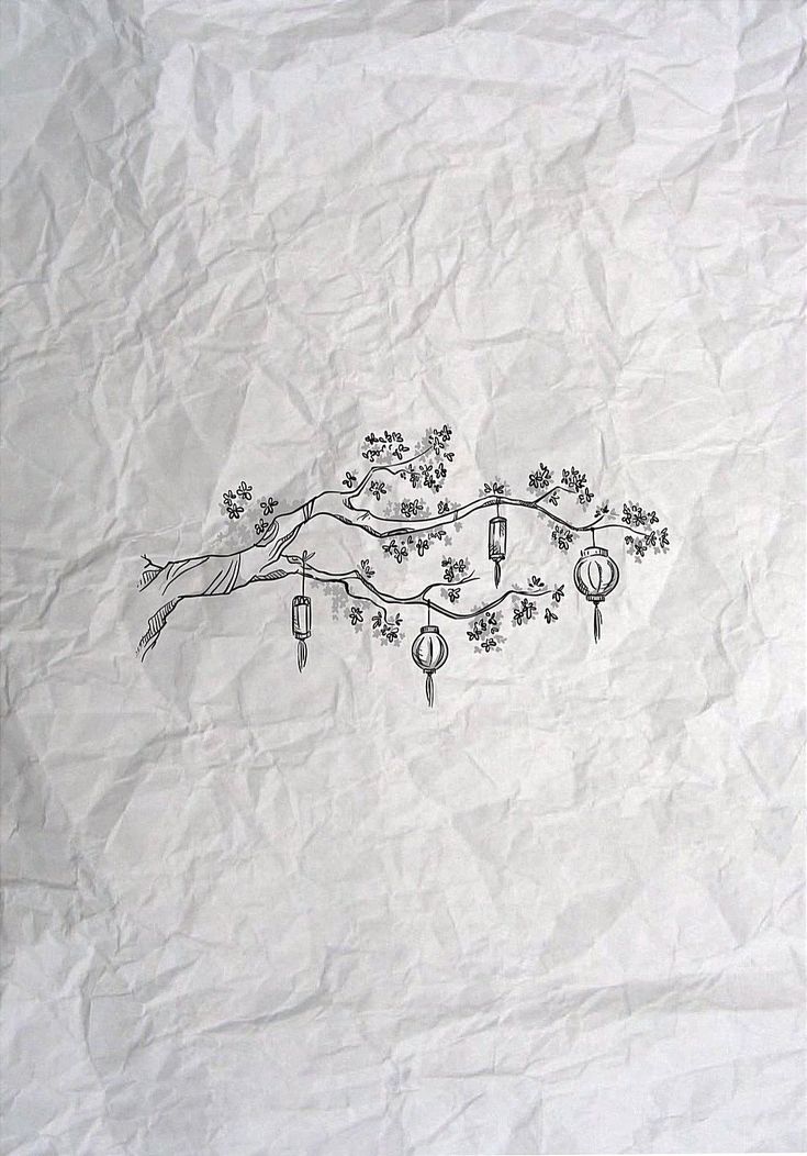 a drawing of a tree branch with ornaments hanging from it's branches on a piece of paper