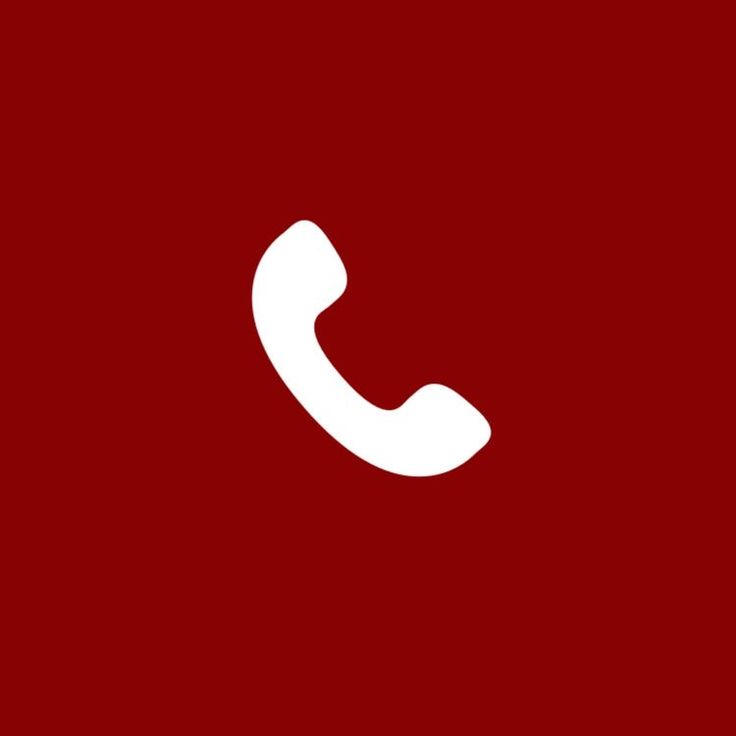 a red wall with a white phone on it's left side and the letter c in the middle