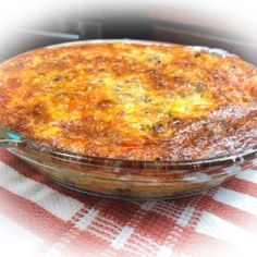 a pie sitting on top of a checkered table cloth