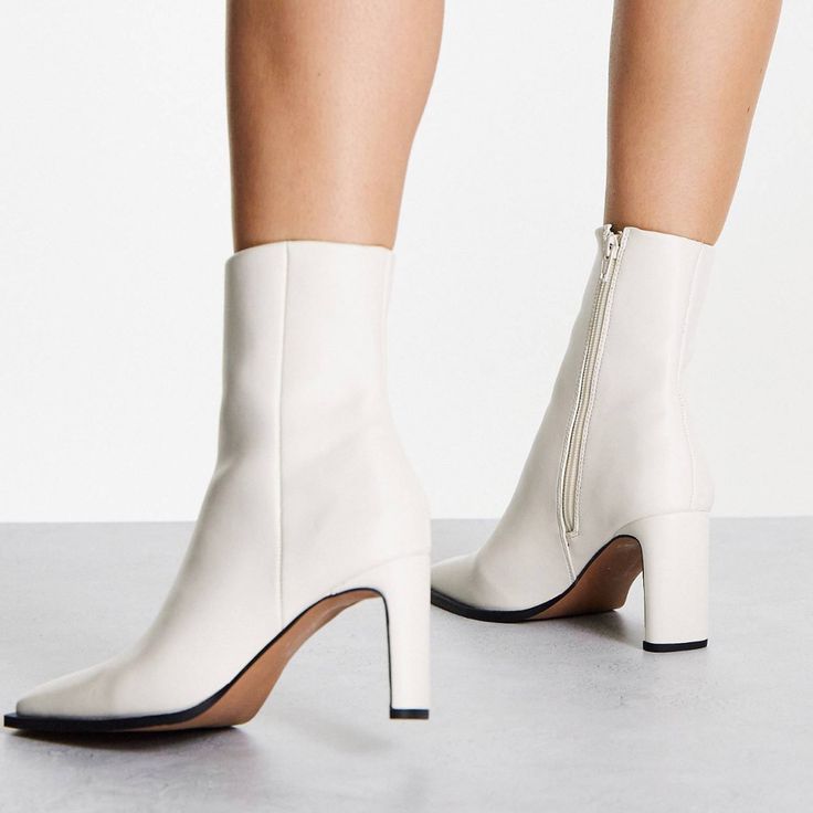 Off White Square Toe Ankle Boots. Would Look Amazing With A Turtleneck Sweater Dress And Pea Coat Or A “Shades Of White/Neutral” Outfit. Depending On How You Style It Can Go Rich Housewife/Mod/Corporate Baddie/Quiet Luxury. Never Worn But I Did Notice A Small Scuff On The Heel So Wanted To Point It Out To You (Yellow Arrow). Note: This Boot Has A Fairly Narrow Shaft So Not Big Calf Friendly. It Is Pretty Snug On Me But I Didn’t Return It Bc I Still Thought It Was Cute . Size 11 | 3.5” Heel Fitted White Faux Leather Boots, White Heeled Boots With Reinforced Heel And Square Toe, White Heeled Boots With Square Toe And Reinforced Heel, Fitted White Heeled Boots With Reinforced Heel, White Faux Leather Heeled Boots For Winter, Fitted White Synthetic Heeled Boots, White Pointed Toe Heeled Boots With Medium Width, White Ankle Boot Heels For Winter, White Synthetic Heeled Boots For Spring