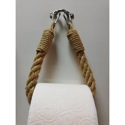 a white toilet paper holder with two roped handles hanging from it's side