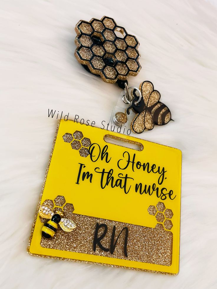 two honeybees are on top of a yellow sign that says oh honey i'm that nurse