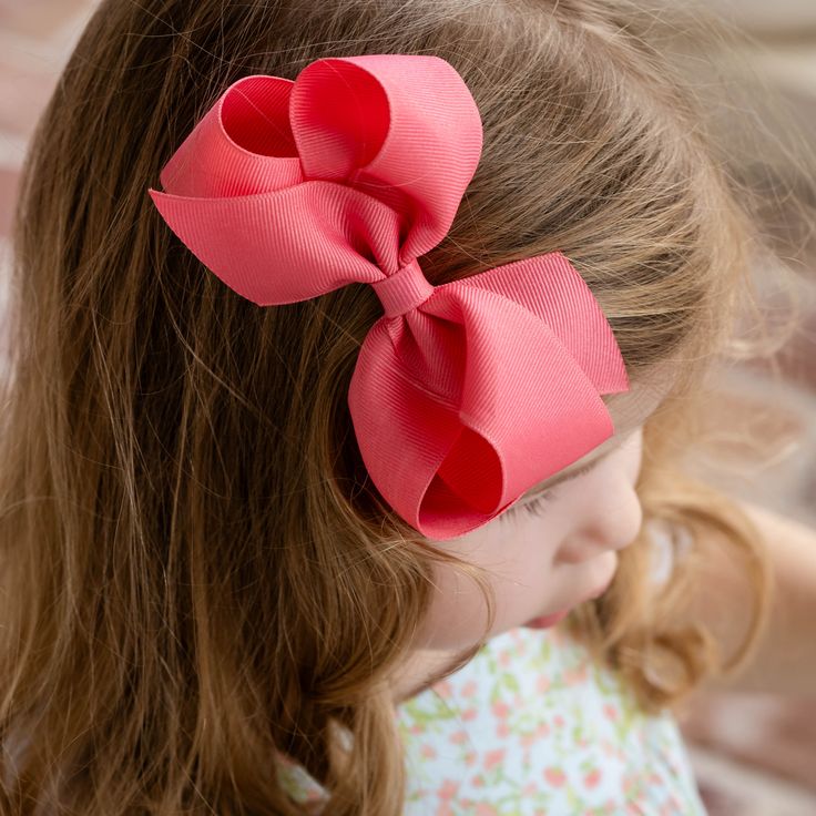 Coral grosgrain bow by Wee Ones is available in two sizes and coordinates with our Spring Collections. Small bow is perfect for toddlers and measures 4" x 3". King bow measures 6-1/4" x 5" and is perfect for older girls and tweens. Both bows are available on a special no-slip alligator clip. Accessories ship with your order. Pink Hair Bow Accessories For Spring, Pink Ribbon Bow For Spring, Spring Pink Hair Accessories With Bow, Cute Satin Bow For Spring, Cute Bow Hair Accessories For Playtime, Playful Pink Satin Bow, Pink Satin Bow Hair Accessories For Spring, Spring Pink Satin Bow Hair Accessories, Spring Pink Hair Accessories With Satin Bow