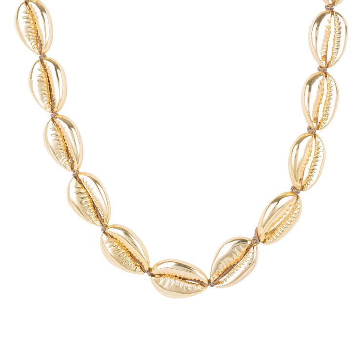 This natured inspired necklace with Cowrie shell inspired detailing is elegant and chic, whilst giving a nod to its bohemian roots. The high polished finish radiates with a metallic shine. The versatility of this necklace means it looks great with a paired down casual look, or as a choker with a little black dress. A definite holiday essential. 22ct gold plated.  Ideal for those who love statement jewellery. A holiday and vacation essential. Pair with our matching coral earrings. Coachella festi Elegant Silver Necklace For Beach, Elegant Shell-shaped Necklace For Vacation, Elegant Silver Strand Jewelry, Elegant Strand Shell Necklace For Vacation, Elegant Shell Jewelry For Vacation, Elegant Silver Shell Necklace For Beach, Elegant Silver Shell Beach Necklace, Elegant Gold Shell Necklace For Beach, Elegant Strand Necklace