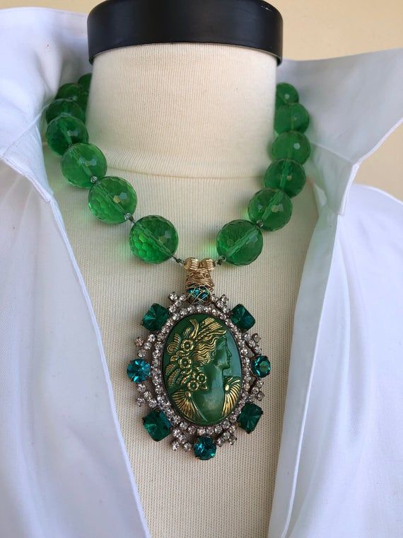 Green Antique Cameo, hand knotted in green silk thread, 20 mm green quartz, Antique Czechoslovakian Gold Jade Jewelry With Faceted Beads, Green Faceted Beads Jewelry As Gift, Green Faceted Beads Jewelry For Gift, Unique Faceted Green Jewelry, Unique Green Faceted Jewelry, One Of A Kind Green Round Bead Jewelry, Green Bohemian Medallion Jewelry, Green Faceted Bead Jewelry For May Birthstone, Green Faceted Beads Jewelry For May Birthstone