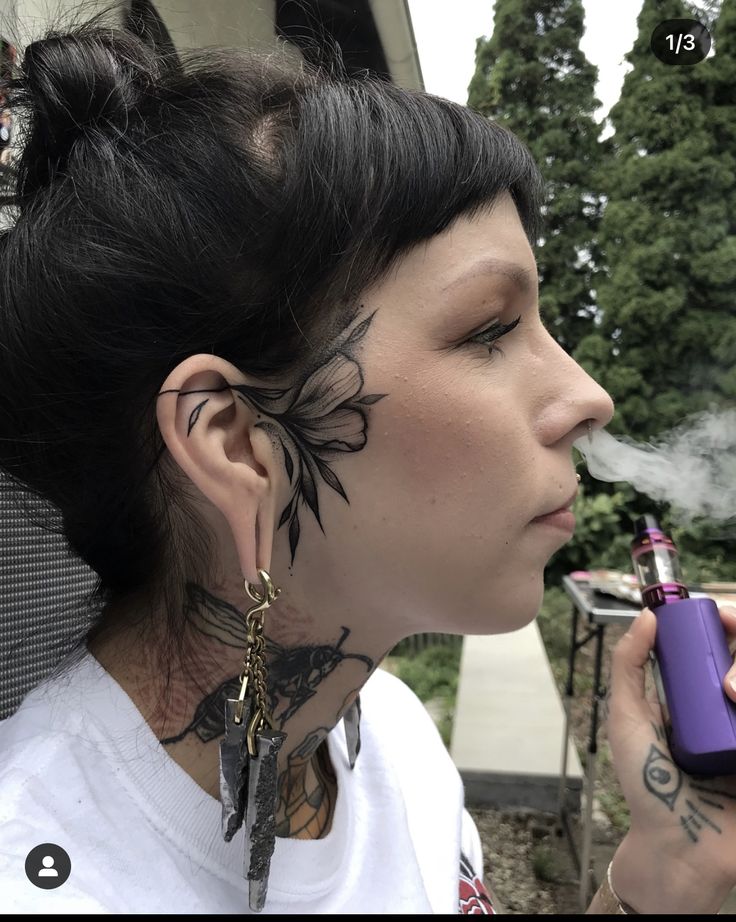 Sideburn Tattoos For Women, Neck And Face Tattoos, Face Tattoo Near Ear, Mandala Face Tattoo Design, Small Side Face Tattoo, Elegant Face Tattoo, Side Of Head Tattoo Women, Small Side Of Face Tattoo, Blackwork Face Tattoo