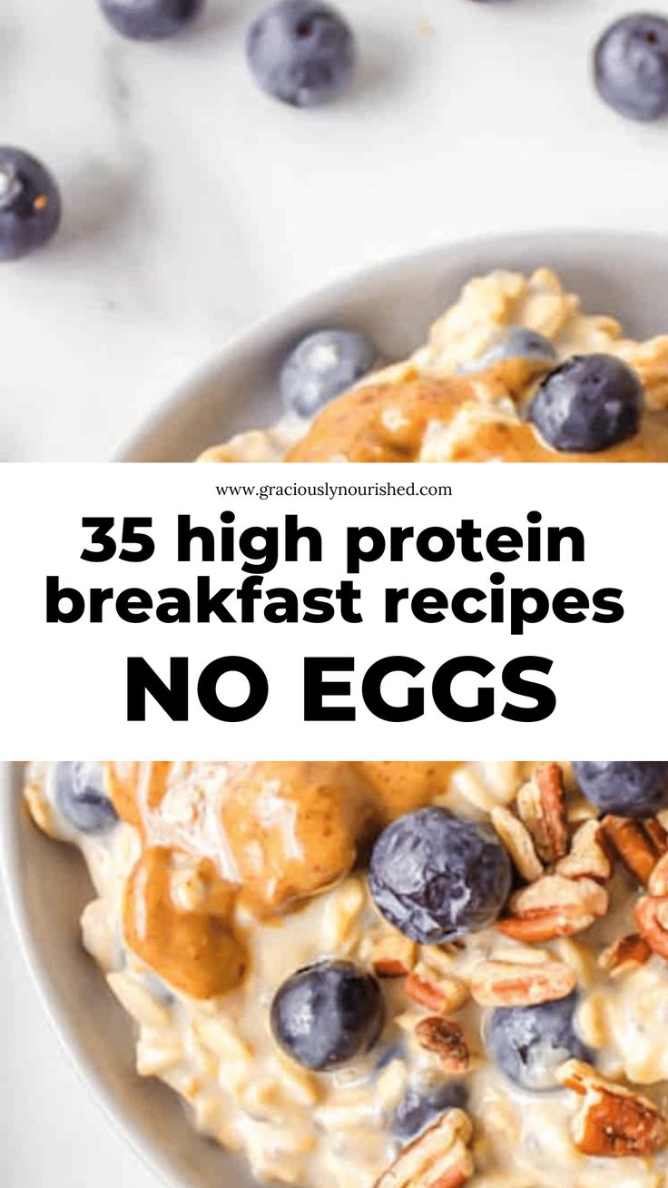 a bowl filled with cereal and blueberries on top of a white table next to some nuts