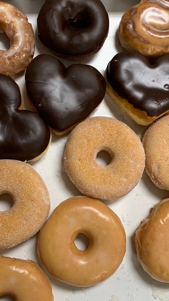 a box filled with lots of different flavored donuts