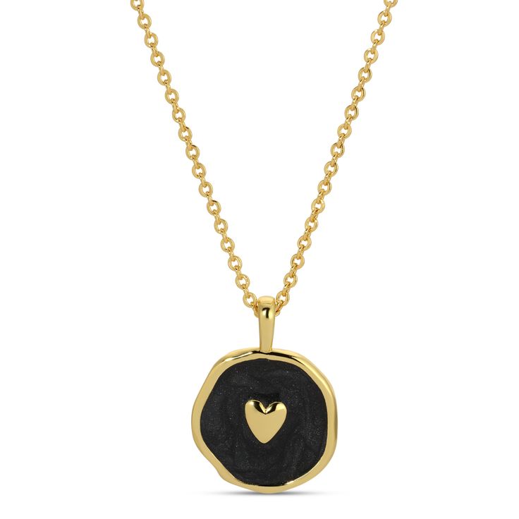 Stunningly crafted, this tiny heart pendant features an enamel background on a brass, plated 18" necklace. .5" Pendant, .75" Drop 18" Necklace 18k Gold Plated Brass Base Enamel Enamel Heart Charm Necklace For Gifts, Gold Heart Jewelry With Black Enamel, Nickel Free Gold Open Heart Necklace, Gold Enamel Heart Necklace For Gift, Gold Open Heart Nickel-free Necklace, Gold Open Heart Necklace Nickel-free, Gold Open Heart Necklace Nickel Free, Personalized Heart-shaped Brass Necklaces, Heart-shaped Enamel Charms Necklaces