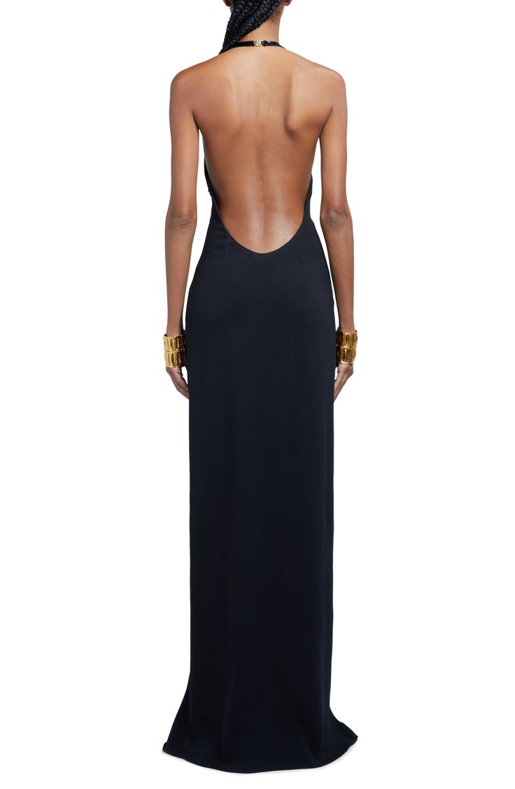 Cutout-carved hardware shines at the crossover halter neck of a figure-clinging evening gown that falls gracefully into a floor-pooling hem. A plunging side slit and daring open back complete this luxe look. 69" length (size 46 IT) Clasps at back; hidden side-zip closure Halter neck Sleeveless, with cutaway shoulders Side slit Lined 97% viscose, 3% polyester Dry clean Made in Italy Designer Clothing Dresses With Back Open, Black Designer Dress, Prom Dress With Open Back, Tom Ford Style, Black Tie Wedding Guest Dress, Designer Clothing Brands, Halter Neck Dress, Halter Gown, Looks Party