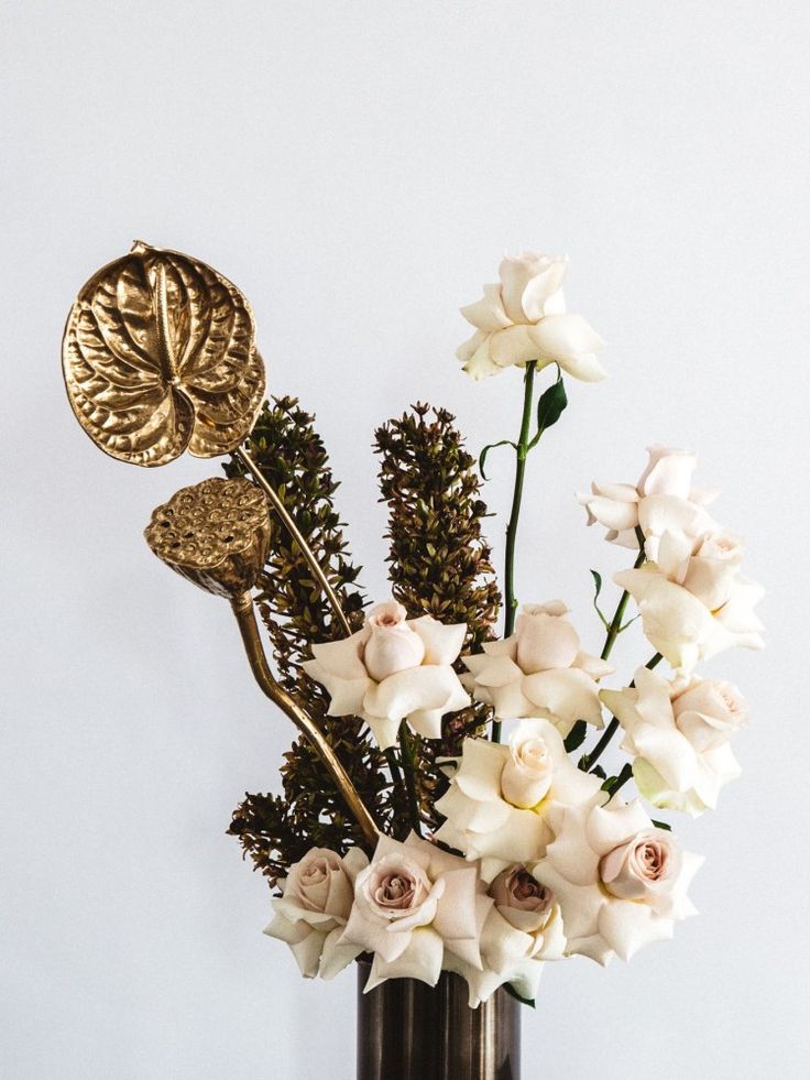 a vase filled with white flowers on top of a table