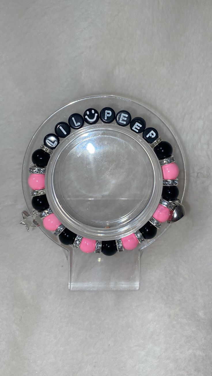 Pink and black, lil peep and black and purple Lil Tracy bracelets, sold single Lil Peep And Lil Tracy Bracelets, Lil Peep Lil Tracy Matching Bracelets, Lil Peep Bracelet, Lil Peep Merch, Peeps Crafts, Lil Peep Hellboy, Diy Kandi Bracelets, Preppy Bracelets, Diy Kandi