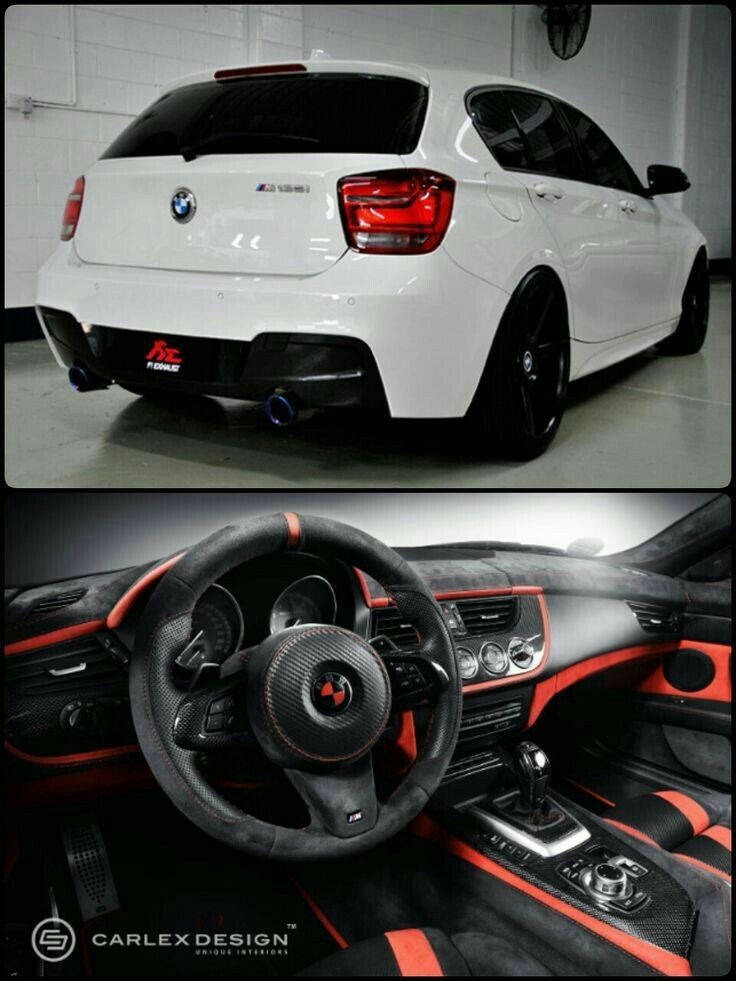 the interior and dashboard of a white car with orange trims, including an automatic steering wheel