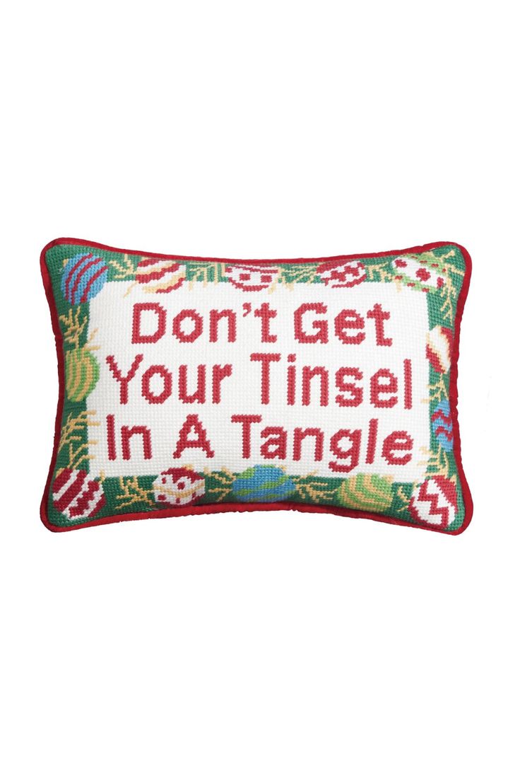 a cross stitch pillow that says, don't get your tinsel in a tangle