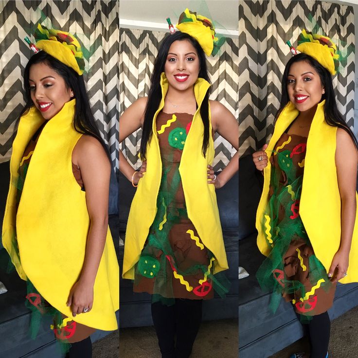 the woman is wearing a costume made out of yellow fabric and green leaves, while standing in front of a wall with chevron