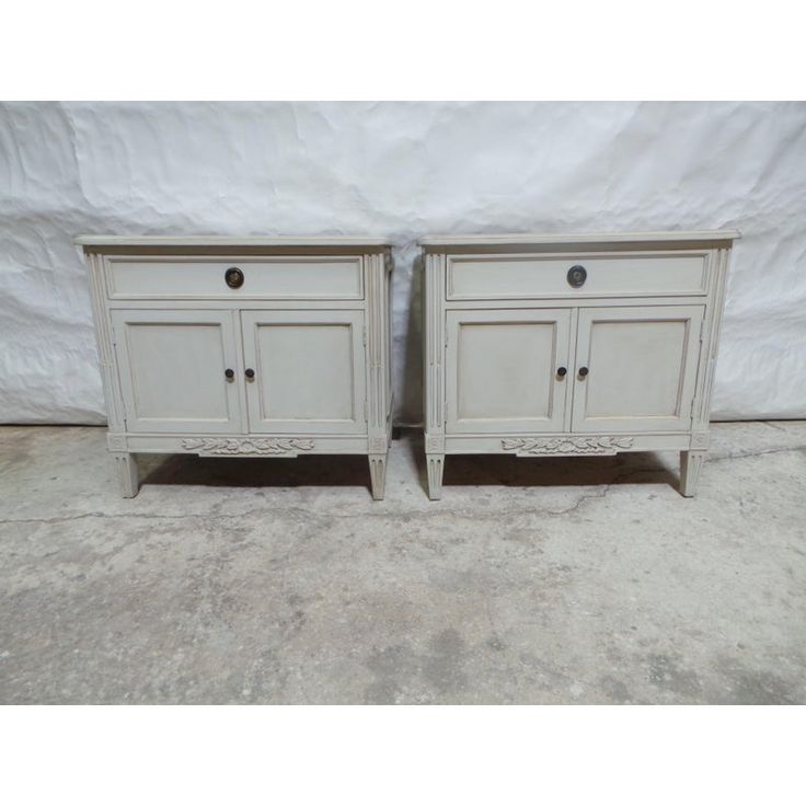 pair of white painted nightstands with drawers