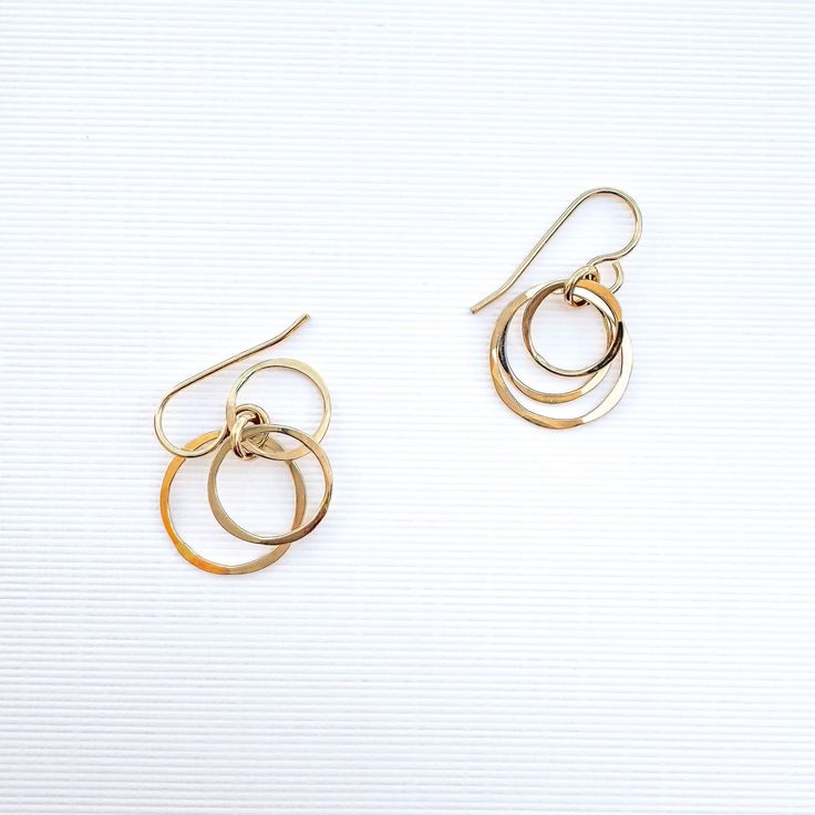 • 14K gold filled 3 nesting circle dangle earrings. Also available in 925 Sterling Silver. • Comes as a pair. • 27mm dangle length, 15mm width of outside circle • French wires 14K gold filled 22 gauge, or 925 Sterling Silver. • These earrings don't require earring backs. But for those with active lifestyles, and if you like a secure fit—we do offer 5mm silicone earring backs. Slide/twist on gently, to preserve the earring's shape. •• Nickel free •• ••••••••••••••••••••••••••Our jewelry is packaged in a cute pillow box or envelope. You can also request a personal message which we hand write onto a gift tag. Please specify if you would like your items individually boxed. •••••••••••••••••••••••••• •••Any questions? Please contact us!••• Thank you so much for supporting our small business! •• Dainty Yellow Gold Circular Earrings, Dainty Circle Earrings In 14k Gold, 14k Gold Open Circle Earrings Gift, Dainty 14k Gold Circle Earrings, 14k Gold Filled Yellow Gold Open Circle Jewelry, Cadmium-free Yellow Gold Dangle Earrings, Nickel-free Gold Open Circle Jewelry, Gold Circle Earrings 14k Gold Filled, Gold Circle Earrings In Sterling Silver